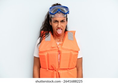 hispanic woman feeling disgusted and irritated and tongue out. life jacket and summer concept