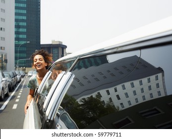 Hispanic Woman In Limousine With Head Out Of Car Window. Horizontal Shape, Copy Space