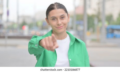 Hispanic Woman Pointing At The Camera Outdoor