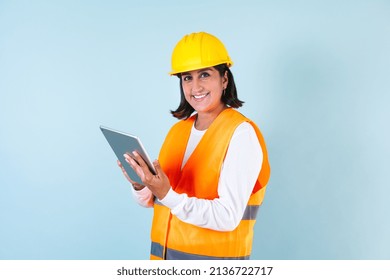 Hispanic Woman Professional Engineering Construction Builder And Hard Worker Holding Digital Tablet With Helmet In Mexico Latin America