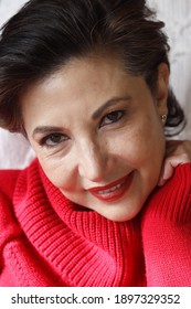 Hispanic Woman With A Red Sweater 