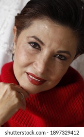 Hispanic Woman With A Red Sweater 