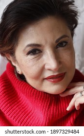 Hispanic Woman With A Red Sweater 