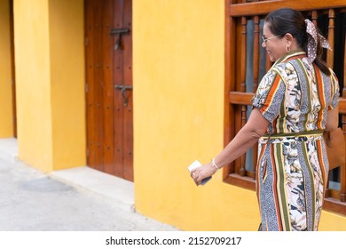 Hispanic Woman Smiling Walking Down A Street