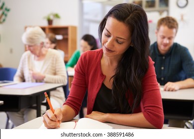 Hispanic Woman Studying At An Adult Education Class