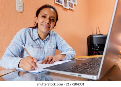 Hispanic Woman Using Computer At Home - Young Woman Working From Home - Young Mother Learning Online