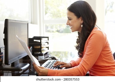 Hispanic Woman Working In Home Office