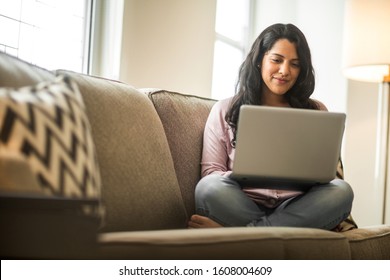 Hispanic woman working on the computer