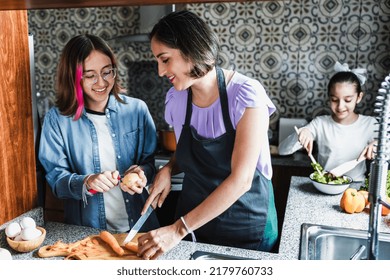 Hispanic Women Mother And Daughters Cooking At Home Kitchen In Mexico Latin America