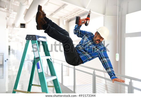 Hispanic Worker Falling Ladder Inside Building Stock Photo (Edit Now ...