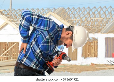 Hispanic Worker Getting Back Injury On Construction Site