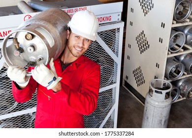 Hispanic Worker Inspecting Gas Canister