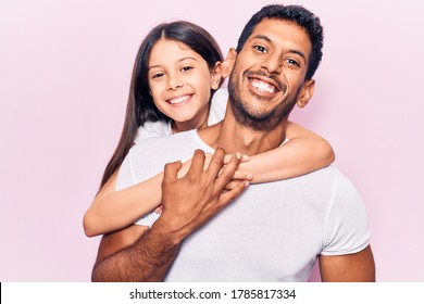 Hispanic Young Family Of Father And Daughter Hugging Together With Love