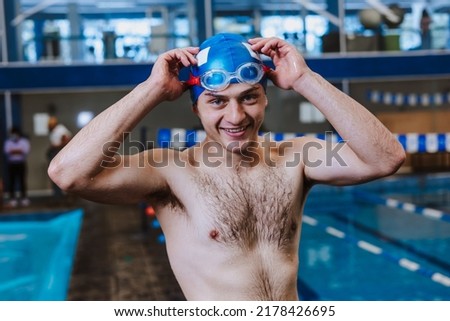 hispanic young man swimmer athlete wearing cap in a swimming training at the Pool in Mexico Latin America