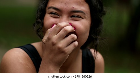 Hispanic young woman receiving unbelievable news from friend, real life emotion reaction - Shutterstock ID 1904360326