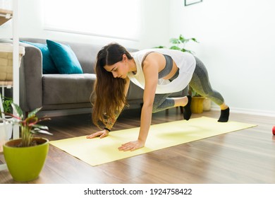 Hispanic Young Woman Training With A High Intensity Interval Workout. Gorgeous Woman Doing Mountain Climbers At Home