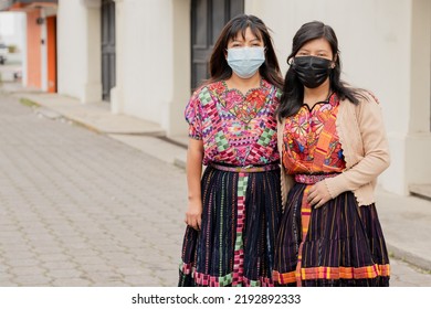 Hispanic Young Women With Face Mask On The Street- Happy Hispanic Sisters In The Village In Latin America