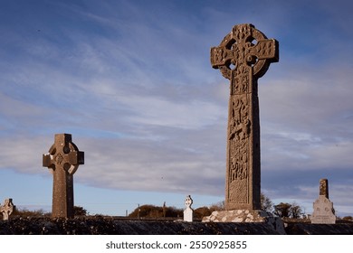 Historic 11th-century Celtic Cross at Drumcliffe Church in Ireland under a clear blue sky - Powered by Shutterstock