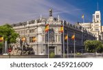 Historic Bank of Spain building timelapse hyperlapse with monument The Cybele Fountain and Cibeles square between Paseo del Prado and Alcala street with car traffic in Madrid, Spain