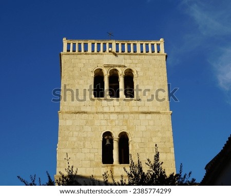 Historic bell tower of Church of the Assumption of Mary in Croatian town of Pag on summer day