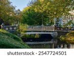 Historic bridge made of brick, stone and steel across Noordsingel canal in an old neighbourhood in Rotterdam, The Netherlands