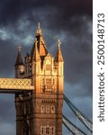 Historic Bridge over River Thames and Cityscape Skyline during dramatic sunset. Tower Bridge in City of London, United Kingdom. Travel Destination.