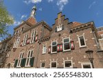 Historic building made of brick and shutters in the city center of Utrecht