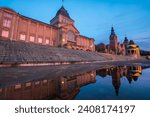 The historic buildings of Haken Terrace in Szczecin reflected in puddles of water