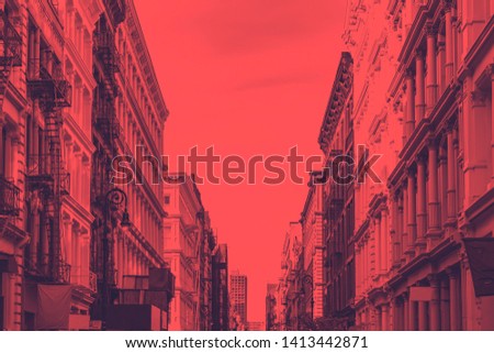 Historic buildings on Greene Street in the SoHo neighborhood of Manhattan in New York City with red dutone color effect