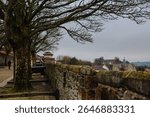 Historic cannons are positioned atop the ancient Londonderry City Walls, offering a glimpse into the city