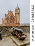 Historic cannons are positioned atop the ancient Londonderry City Walls, offering a glimpse into the city
