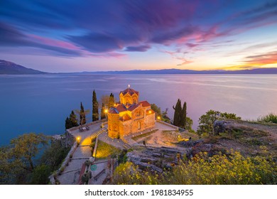 Historic Church of Saint John the Theologian, situated on the cliff over Kaneo Beach overlooking Lake Ohrid with magnificent twilight sunset, Republic of North Macedonia.