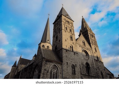 Historic church towers rise under a dramatic sky in Ghent, Belgium during late afternoon lighting - Powered by Shutterstock