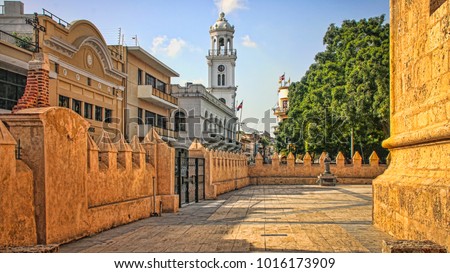 Historic City Center Plaza with Skyline of Colonial Buildings and Church (Santo Domingo, Dominican Republic).