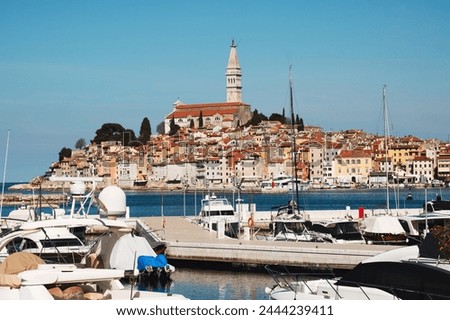 Historic cityscape of Croatian Mediterranean sea coast - old town Rovinj Croatia and boats on water of Istria Croatia
