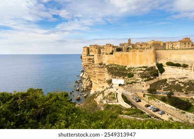 Historic cliffside village overlooking the Mediterranean Sea in Corsica on a sunny day with blue skies and scenic views - Powered by Shutterstock