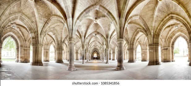 The historic Cloisters of Glasgow University. Panorama of the exterior walkway. Image taken from an outdoor public position.