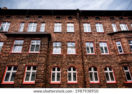 Historic coal miners settlement - Nikiszowiec, district of Katowice in Silesia, Poland. Traditional workers' housing estate (familoks) made of brick