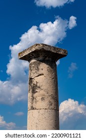 Historic Column In Famous Excavated Comune Of Pompei Near Naples Italy On Sunny Summer Day With Blue Cloudy Sky. The Roman City Was Buried Under The Ashes Of Vesuvius Volcano And Now Is Popular Sight.