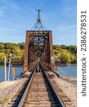 Historic Dubuque railroad bridge between Iowa and Illinois across the Mississippi river with swing span open for shipping