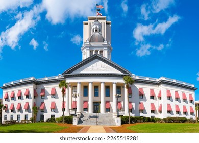 Historic Florida State Capitol Building with brightly colored striped awnings, classical style dome, and American and Florida State Flags in Tallahassee - Shutterstock ID 2265519281