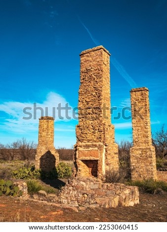 Historic Fort Phantom Hill in Abilene, Texas, USA, three tall ruined chimneys