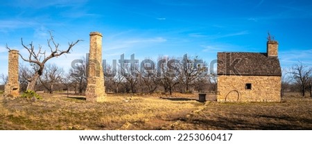 Historic Fort Phantom Hill in Abilene, Texas, USA, tranquil winter landscape with stone house and chimneys