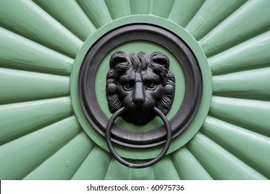 Historic green door with ornament lion in Prague, Czech republic