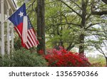 Historic Home With Texas and American Flags