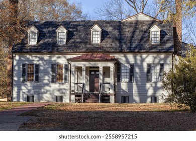 Historic house with brick chimneys and dormer windows. - Powered by Shutterstock