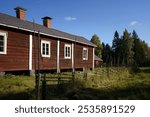 Historic house and old wooden fence in Kovero Heritage Farm in Seitseminen National Park. Ikaalinen, Finland