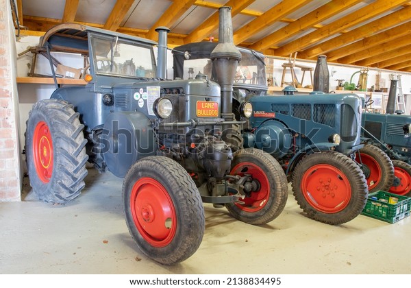 Historic Lanz Bulldog tractors in a farm\
market in Münster, Germany,\
03-14-2022