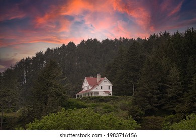 Historic Lighthouse Keepers House At Sunsetat Heceta Head Near Cape Perpetua On The Oregon Coast Near Floresnce.