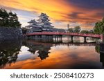 The historic Matsumoto Castle in Matsumoto, Japan at dawn.